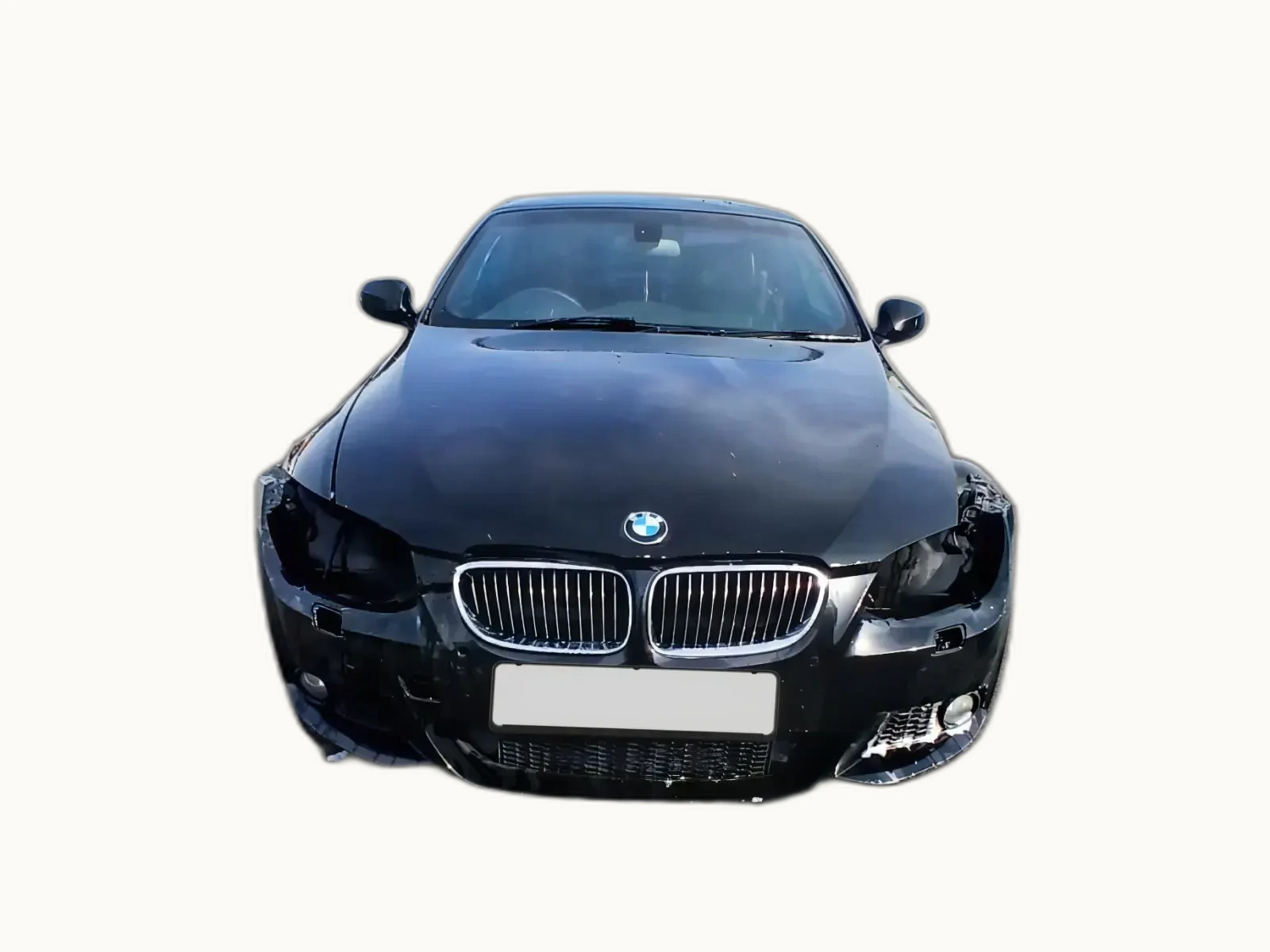 Black BMW 3-Series coupé photographed head-on with the nearside headlight smashed and the bonnet lightly creased, but the front structure visibly intact