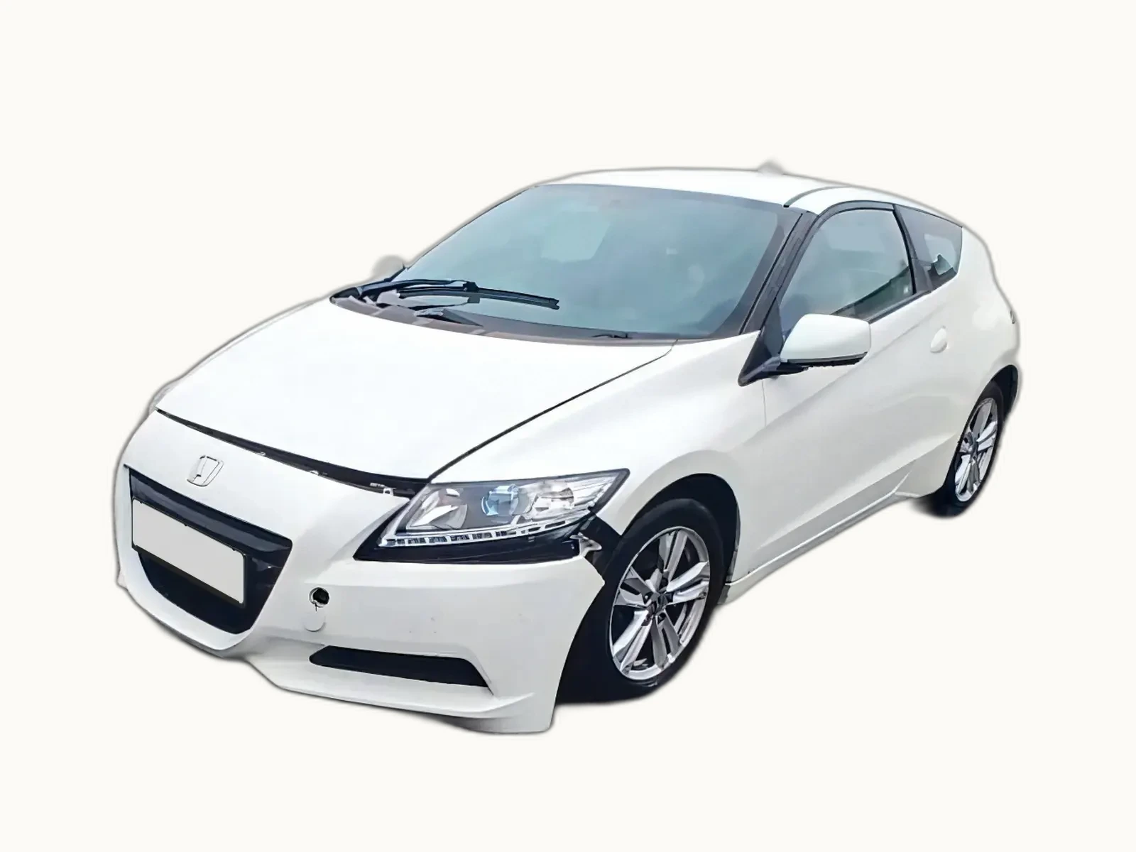 White Honda CR-Z coupé photographed from the front-left three-quarter angle with only minor cosmetic damage visible, the kind of presentation a Cat N car typically has after repair