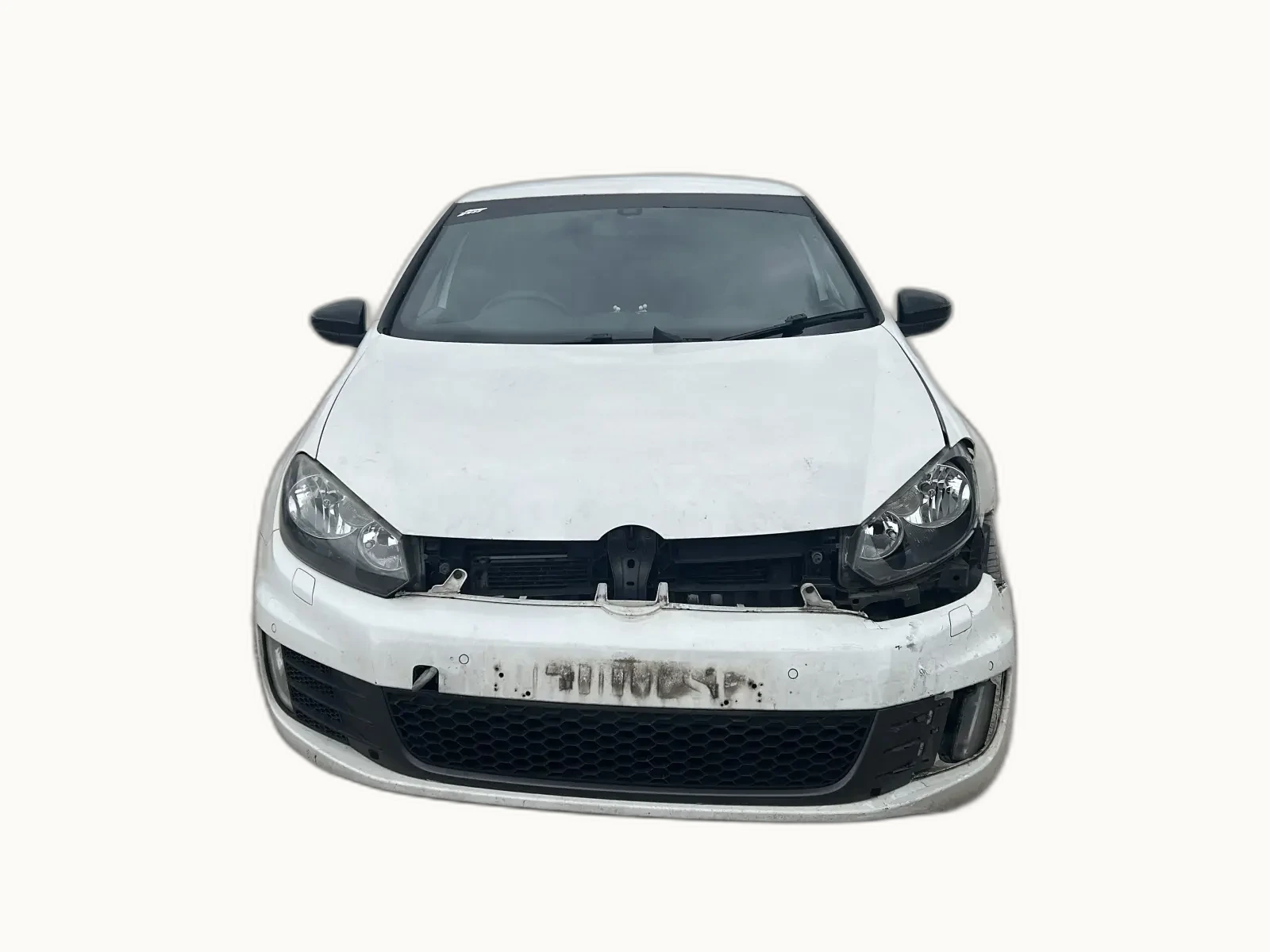 White VW Golf GTI with its front bumper removed and bonnet crumpled, exposing the front chassis rails, crash bar and inner structural members