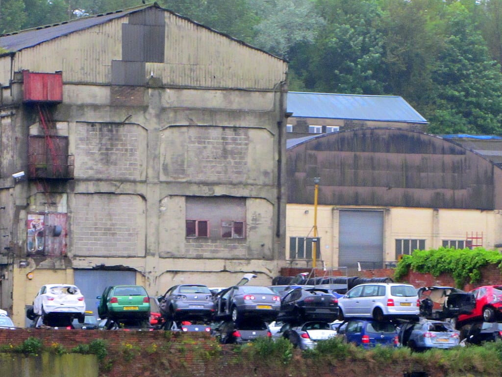 Stacked accident-damaged cars at a breakers yard in Bill Quay, Gateshead